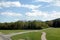 Countryside roads in foothills of the alps  under blue sky with white clouds on bright sunny day