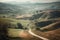 countryside with rolling hills and winding road