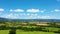 Countryside rural clouds Timelapse. Tropical scenery. Motion at blue sky.