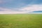 Countryside Rural Field Meadow Landscape In Spring Cloudy Day. Scenic Agricultural Landscape