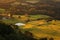 Countryside solitary farm with pond by sunset