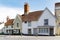 Countryside street with traditional British houses, old-fashioned English town