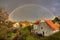 A countryside town with rainbow