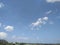 The countryside under the cloud fluffy sky.