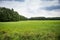 Countyside with Forest and Meadow under Cloudy Sky, Germany