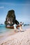 Couple on a 4 Island trip in Krabi visit Railay beach, tropical Island men and woman in swimwear on the beach in