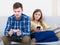 Couple addicted to social networking with cell phones