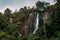 Couple admires a beautiful waterfall