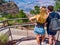 Couple admires Panorama of Grand Canyon National Park Mather Point Arizona USA