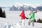 Couple Admiring Mountain View In Mountains