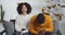 Couple afro american man husband boyfriend and black woman wife girlfriend sitting at home on couch in sweaters near