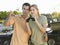 Couple Against Jeep With Binoculars