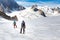 Couple alpinists mountaineers walking glacier  slopes. Mont Blanc