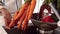 Couple with apron washing vegetables