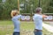 Couple archery athlete aiming at target