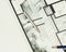 Couple of artistic drawing pencils on authentic real estate floor plan graphic material