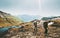 Couple backpackers hiking together in mountains