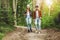 Couple with Backpacks Enjoying Forest Nature