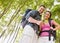 Couple in backpacks looking at compass