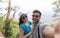 Couple With Backpacks Take Selfie Photo Over Mountain Landscape Trekking, Young Man And Woman On Hike Tourists