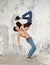 Couple ballet dancing on wall background