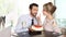 Couple at the bar with sparkling wine and cake, love concept