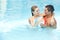 Couple bathing with beach ball