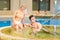 Couple in bathing suits in the pool resting spa center