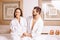 Couple in bathrobes relaxing in spa center