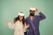 Couple in bathrobes wear vr glasses. Conscious awakening. Return to reality. Man and woman explore vr. VR technology and