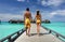 Couple on a beach jetty at Maldives