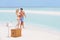 Couple On Beach With Luxury Champagne Picnic