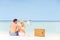 Couple On Beach With Luxury Champagne Picnic