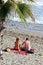 Couple on beach, Marbella, Spain.