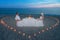Couple at beach romantic dinner with candles heart