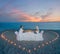 Couple at beach romantic dinner with candles heart