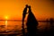 Couple on the beach at sunset silhouettes-Romantic summer