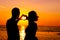 Couple on the beach at sunset silhouettes-Romantic summer