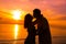 Couple on the beach at sunset silhouettes-Romantic summer