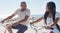 Couple, bike and beach for fun bonding in a happy, loving relationship in Cape Town, Sea Point. Cycling, fitness and