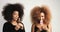 Couple of black womans with huge afro hair