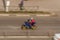 Couple on a blue sports motorcycle rides on a city road. Man with woman riding a motorbike on the street at high speed. concept of