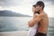 Couple, boat and embrace on ocean on vacation, love and relax by water on summer holiday. People, cruise and bonding for