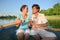 Couple in a boat with a glass of champagne