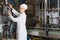 Couple bottling milk on manufacture