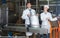 Couple bottling milk on manufacture