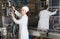 Couple bottling milk on manufacture