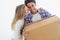 Couple, boxes and happy with kiss for real estate, new home or property investment with romance or love. Moving, man and