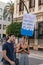 Couple of boy and girl with a banner with the slogan `Politician, do you need us to shout louder?` at the Manifestacion de Murcia