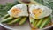 Couple Breakfast sandwich with avocado and fried eggs